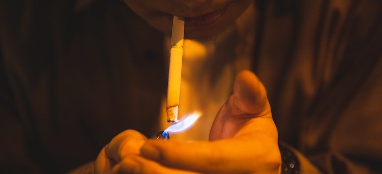 Difference between tolerance, dependence and addiction is in different stages of one's journey. Man smoking cigarettes.