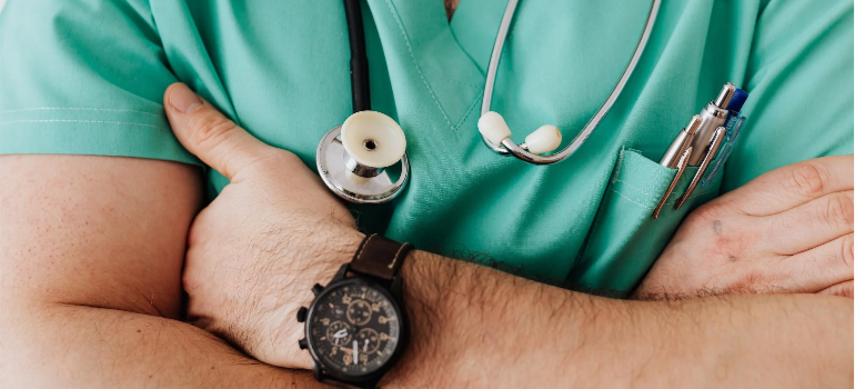 A close-up of a medical professional wearing a stethoscope.