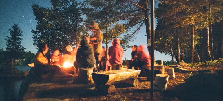 A photo of friends in nature at night.