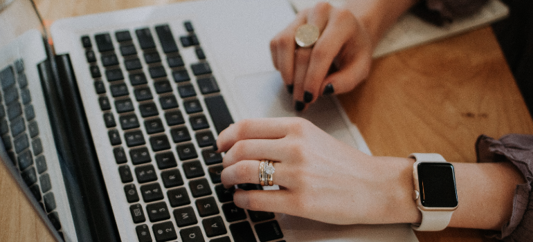 A woman researching on her laptop: How does alcohol affect sleep?