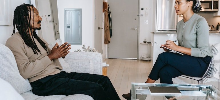 Man and his therapist having a conversation.