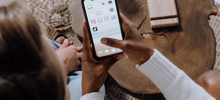 You can find meditation techniques for people with drug or alcohol addictions in apps.Woman holding phone.
