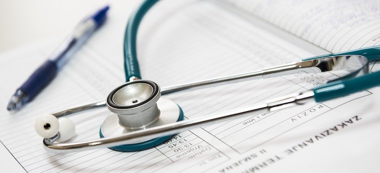 close up picture of a stethoscope and a patient's chart