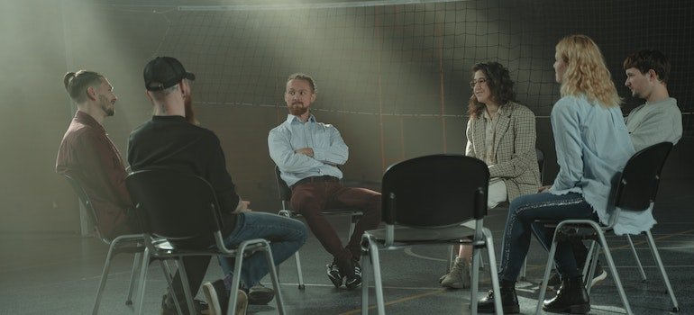 people attending group therapy