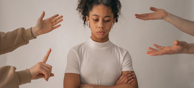 A teenage girl being scolded.
