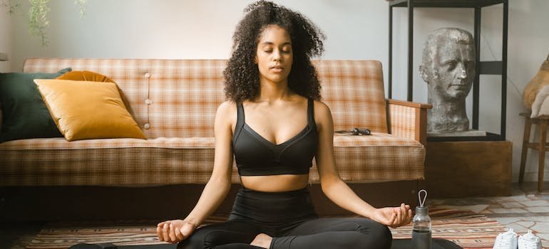 woman meditating on the floor