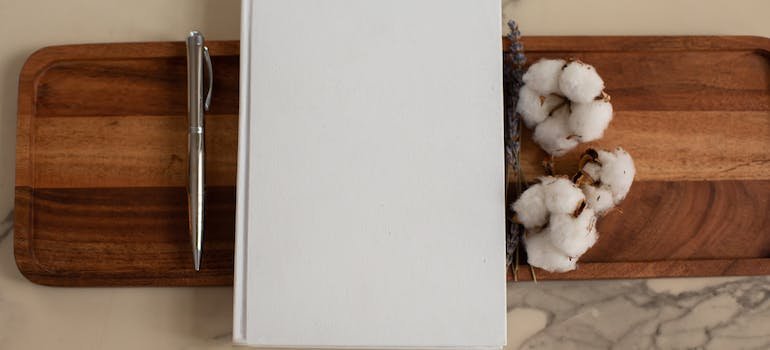 white notebook and a pen