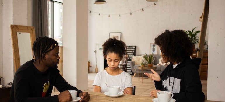 Parents having a conversation with their child.
