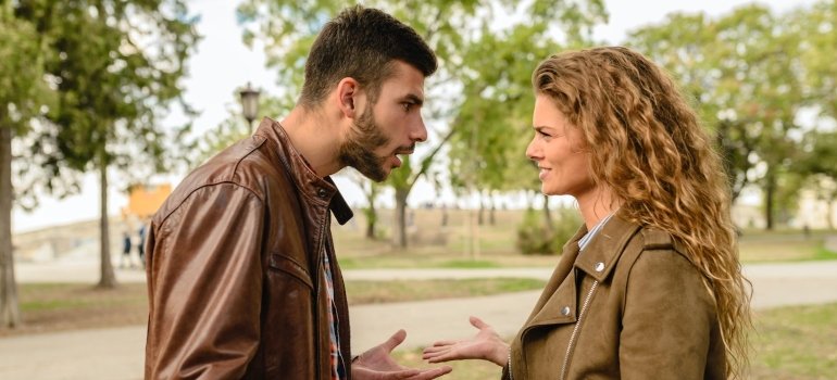 Couple arguing in the park during daytime