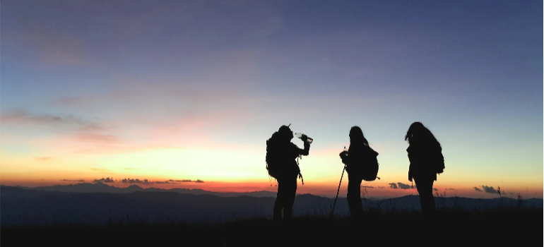 A group of friends on a mountaintop.