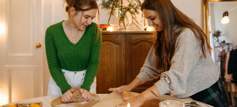 two girls making cookies 