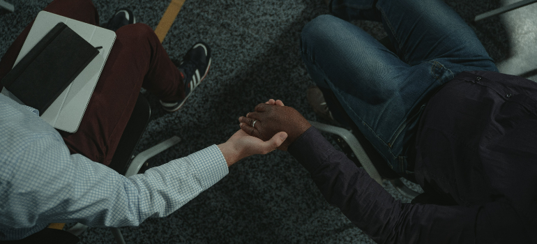 two people holding hands