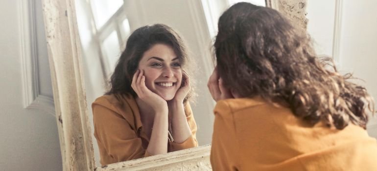 happy person looking in the mirror