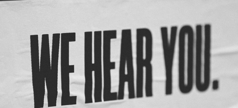 Picture of a white sign with black letters 