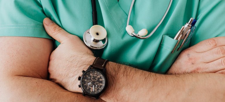 a doctor with crossed hands