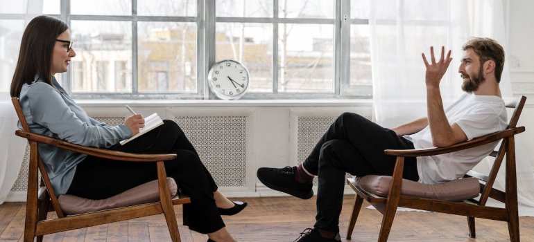 a patient and a therapist talking