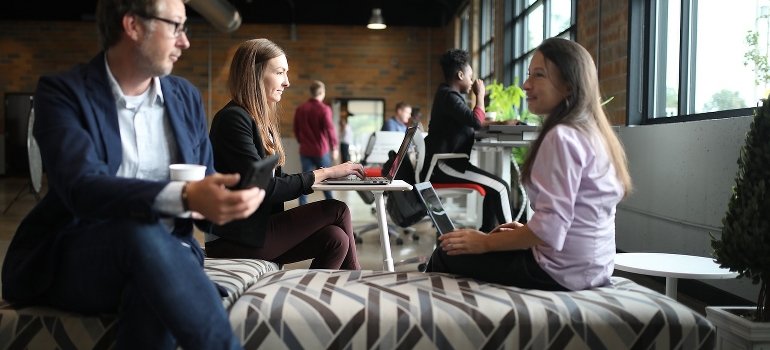 Coworkers at the workplace talk about ways to handle a coworker's drug or alcohol addiction. 