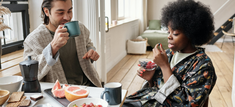 a man and a woman having lunch together after reading the post "The Role of Partners in Men's Recovery Journey"