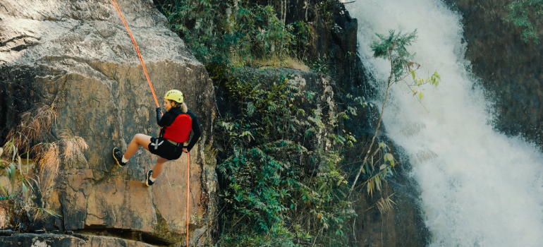 a girl rock climbing 