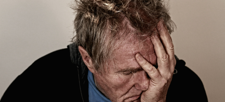 a man holding his head