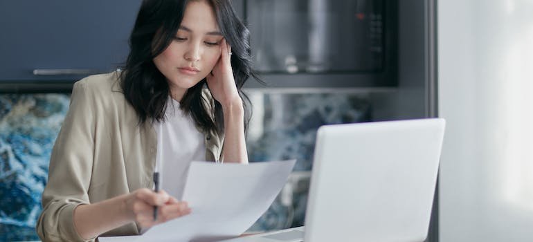 woman holding a piece of paper