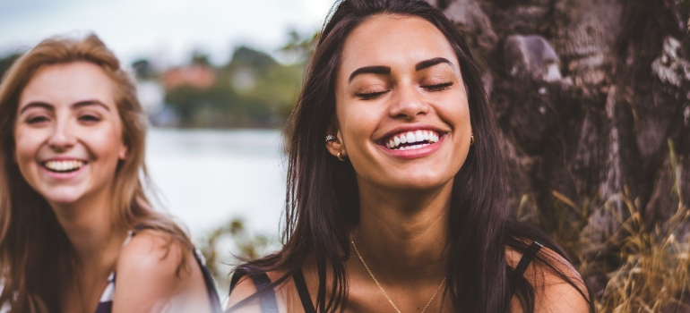 two girl smiling after recovering with adventure therapy for substance abuse in Little Creek