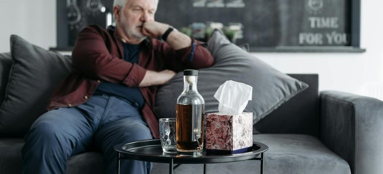 A senior sitting on the couch.