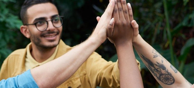 People putting their hands together