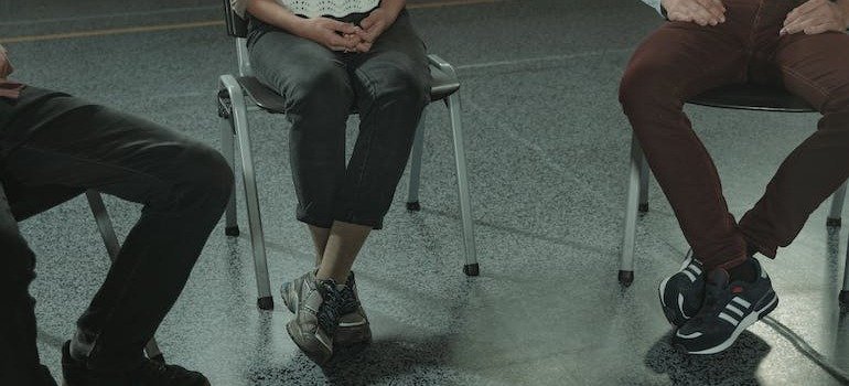 People sitting in a room during group therapy for addiction in PA