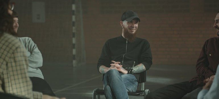 A group of people smiling during a support group meeting in PA