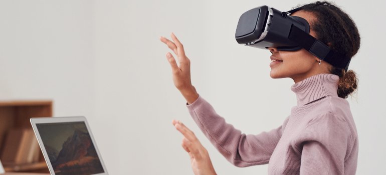 A woman using virtual reality therapy in addiction treatment in PA.