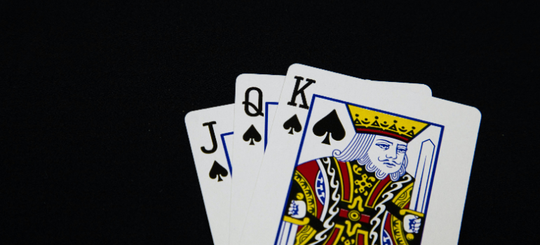 playing cards on a black surface 