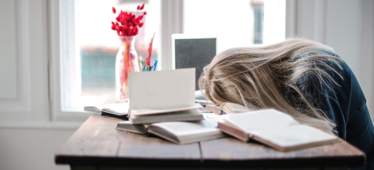 a girl having a hard time studying showing why drinking games are a concern for Pennsylvania's college students