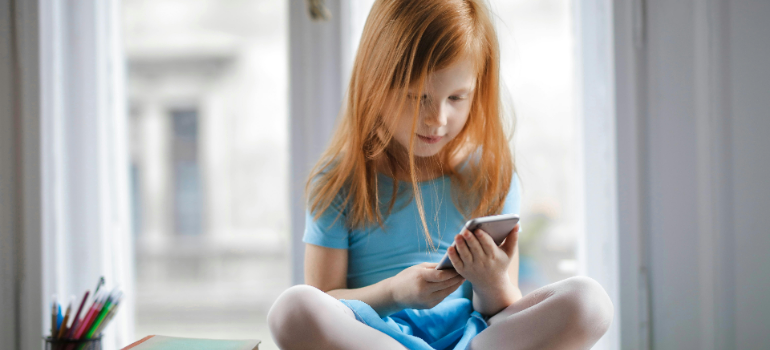 a child holding a phone