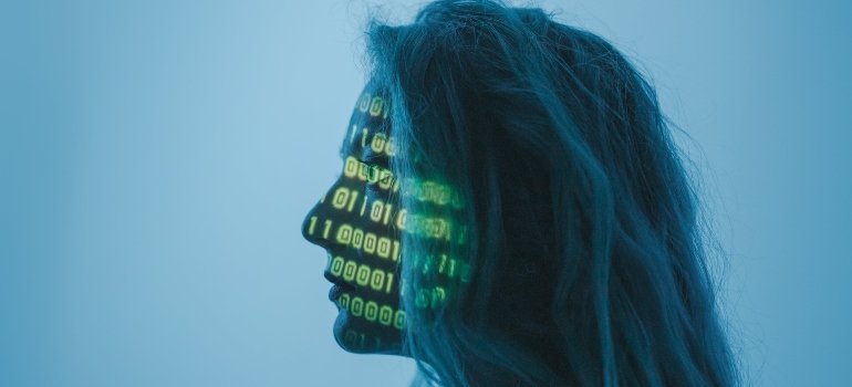 A woman with letters and numbers on her face.