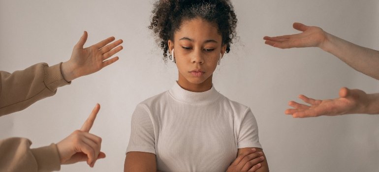 A woman being pointed at.