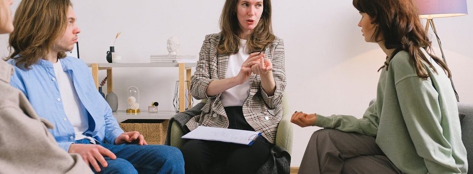 A group of people discussing the best option for rehab in Wilkes Barre PA during the therapy session.