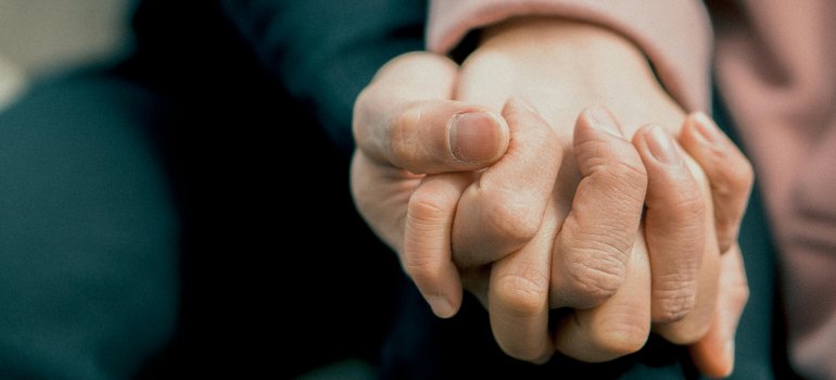 Two people holding hands.