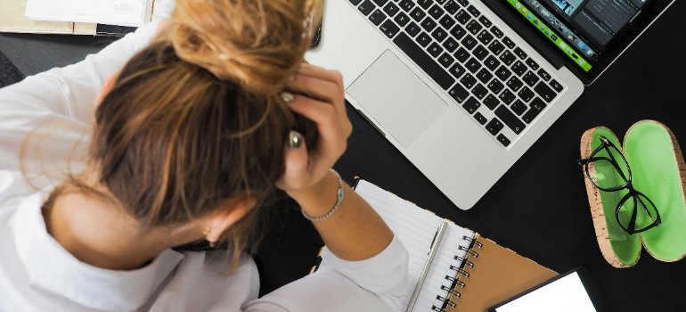 a woman feeling stressed about work