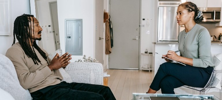 A man talking to a therapist about how to overcome prescription drug addiction