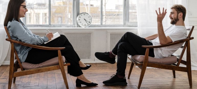 a man in therapy talking to a therapist 