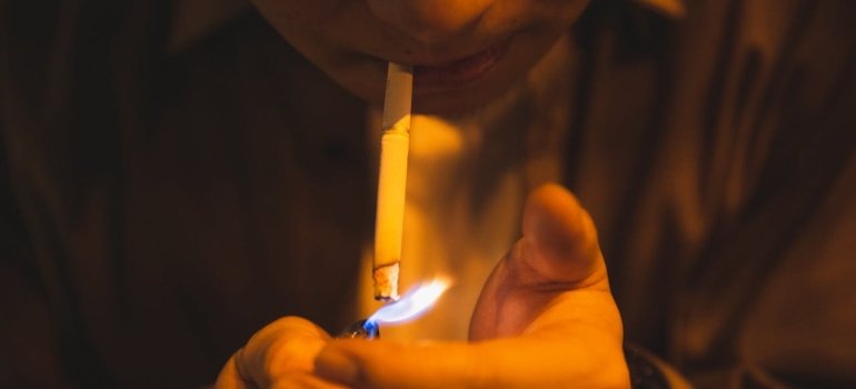 a man lighting a cigarette