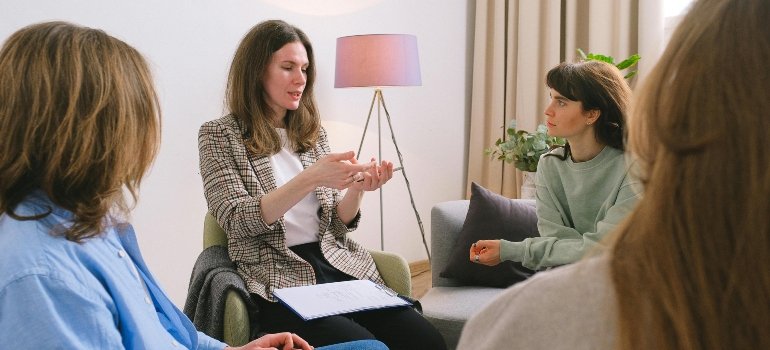 A therapist explaining how to help a loved one with addiction