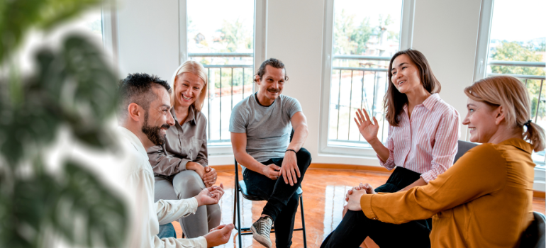 Five young men and women attend group therapy