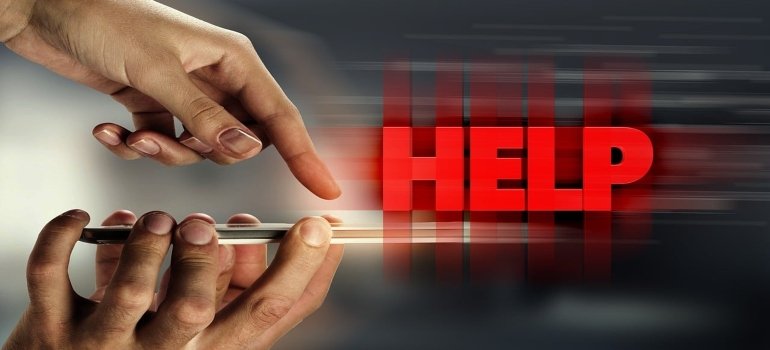 a person pointing to a help sign 