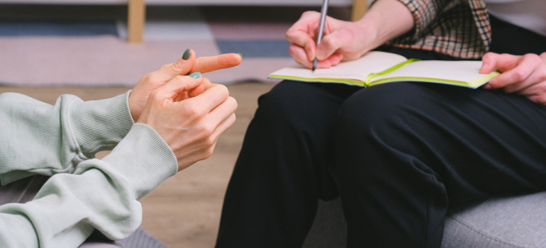 a woman in therapy asking her therapist if she will gain weight after quitting drugs