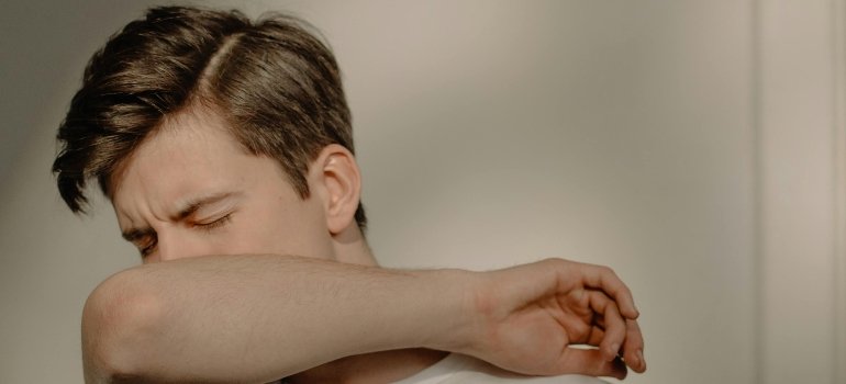 a man feeling unwell after mixing Dramamine and alcohol 