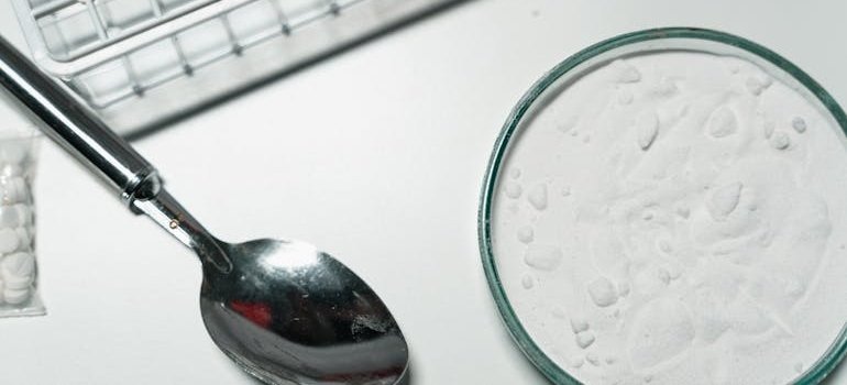 Cocaine, one of the most damaging drugs for Your brain, next to a spoon.