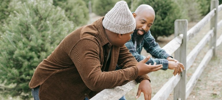 A father talking to son about the impact of parental addiction on child development in PA