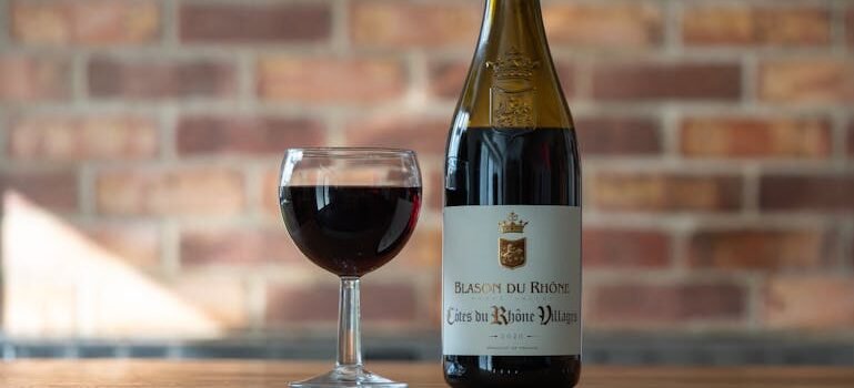 a bottle of wine and a glass